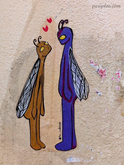 Street art Rue Alexandre Cabanel à Montpellier avec personnages ailés colorés et ambiance poétique dans le centre historique sud