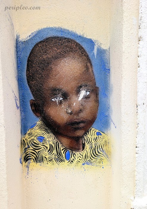 Street art représentant le visage d’un jeune enfant dans la Rue Lamartine à Montpellier dans le Quartier Méditerranée