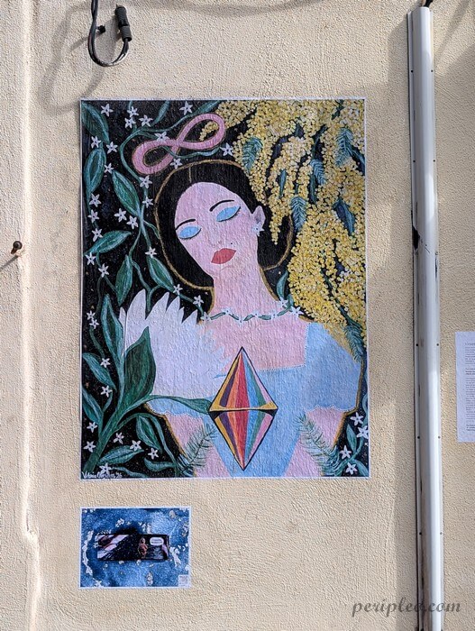 Street art poétique dans la Rue Méditerranée à Montpellier, portrait féminin entouré de mimosa et de motifs floraux