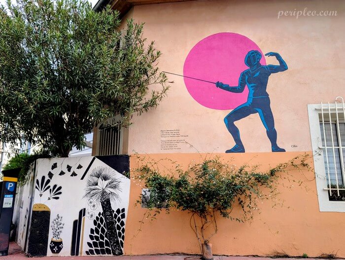 Street art Rue Pralon à Montpellier, fresque murale représentant un escrimeur devant un grand cercle rose dans le Quartier Méditerranée